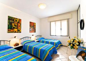 A bed or beds in a room at Glicini
