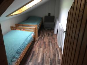 Łóżko lub łóżka w pokoju w obiekcie Wagnermoosgut