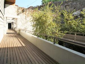 a wooden walkway next to a wall with stairs at LUXURY VIEWS by YoursPorto in Vila Nova de Gaia