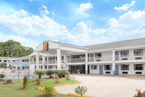 an exterior view of a hotel at Super 8 by Wyndham Biloxi Ocean Springs in Ocean Springs