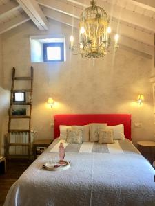 A bed or beds in a room at Doña Palmira