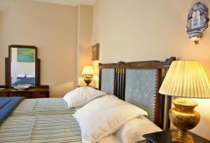 Posteľ alebo postele v izbe v ubytovaní Hotel Santa Coloma del Camino