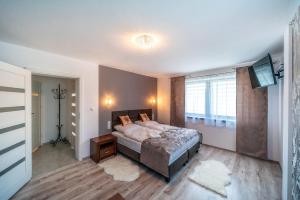 Posteľ alebo postele v izbe v ubytovaní Apartament Glamour