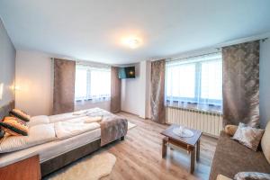 Posteľ alebo postele v izbe v ubytovaní Apartament Glamour
