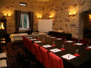 a room with a long table with red chairs at Casa D' Joao Enes - Afife Residence in Afife