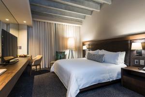 Ένα ή περισσότερα κρεβάτια σε δωμάτιο στο Movich Hotel Las Lomas