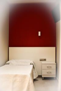 Postel nebo postele na pokoji v ubytování Hostal Playa Candor
