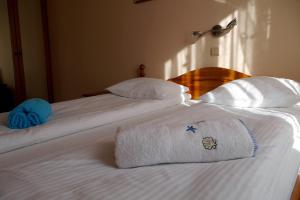 Łóżko lub łóżka w pokoju w obiekcie Apartamenty Klemens