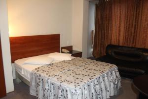 Postel nebo postele na pokoji v ubytování Hostal Bond