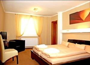 מיטה או מיטות בחדר ב-Hotel Galileo