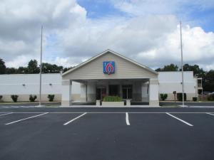 a large building with a sign on the side of it at Motel 6-Bay Minette, AL in Bay Minette