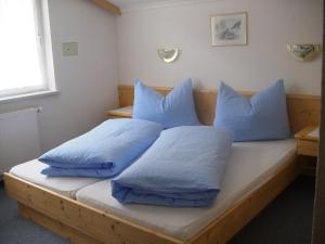 מיטה או מיטות בחדר ב-Apart Fortuna