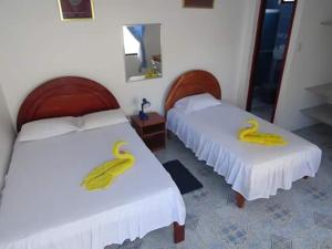 Voodi või voodid majutusasutuse Hostal Insular toas