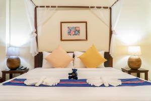 Кровать или кровати в номере Sunny V Hotel