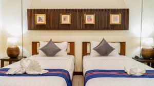 Кровать или кровати в номере Sunny V Hotel