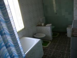 a bathroom with a bath tub and a toilet at Apartment Fazana, Istria 13 in Fažana