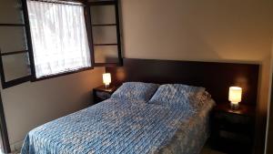 Een bed of bedden in een kamer bij Vento Sul