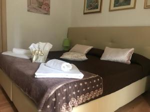 A bed or beds in a room at AFFITTACAMERE Il Cortile