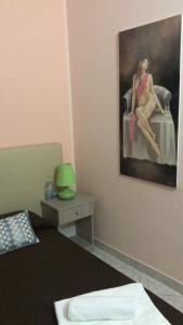 A bed or beds in a room at AFFITTACAMERE Il Cortile
