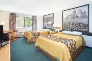 Postel nebo postele na pokoji v ubytování Budget inn & Suites