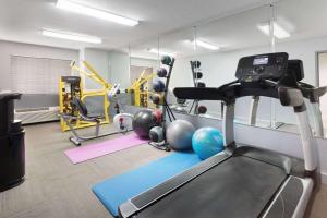 a gym with a treadmill and exercise equipment at Microtel Inn & Suites by Wyndham Stockbridge/Atlanta I-75 in Stockbridge