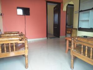 Televizorius ir (arba) pramogų centras apgyvendinimo įstaigoje Coorg villas