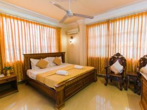 Postel nebo postele na pokoji v ubytování Asia Hotel