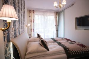 Posteľ alebo postele v izbe v ubytovaní VIP Apartamenty POD KROKWIĄ SPA