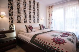Posteľ alebo postele v izbe v ubytovaní VIP Apartamenty POD KROKWIĄ SPA