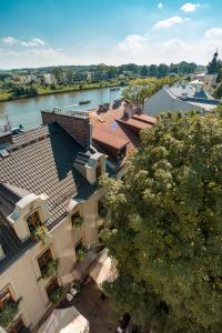 an overhead view of a building with a river behind it at Blue Swan in Krakow