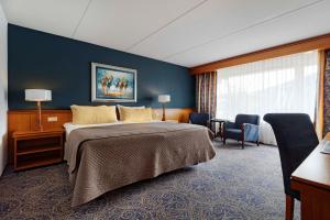 Postel nebo postele na pokoji v ubytování Van der Valk Hotel Emmeloord