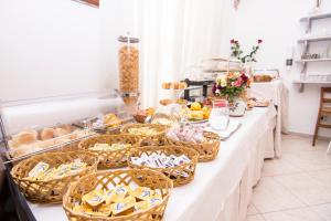 a buffet line with food and baskets of food at Hotel Fontana in Amalfi