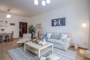 a living room with a couch and a table at Chengdu Chenghua·Giant Panda Breeding Base Locals Apartment 00149350 in Chengdu