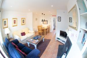 a living room with a couch and a table at Liberty Townhouses in Dublin