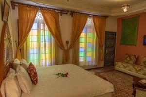 Postel nebo postele na pokoji v ubytování Riad Tahra & Spa