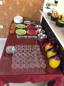 a table with many different types of food on it at Hotel Living in Šuto Orizari