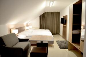 Postel nebo postele na pokoji v ubytování Hana Aparthotel