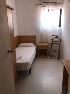 Ένα ή περισσότερα κρεβάτια σε δωμάτιο στο Whitestar Guesthouse