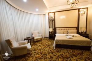 Postel nebo postele na pokoji v ubytování Atlas Hotel Baku