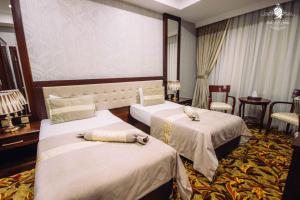 Postel nebo postele na pokoji v ubytování Atlas Hotel Baku