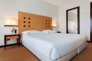 Postel nebo postele na pokoji v ubytování Hotel Lux Fatima