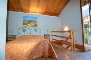Ein Bett oder Betten in einem Zimmer der Unterkunft Rustico Giulietta e Romeo