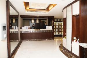 a lobby of a restaurant with a reception counter at Mark Inn Hotel Deira in Dubai