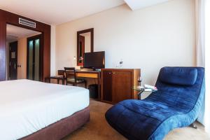 Postel nebo postele na pokoji v ubytování Hotel Lux Fatima