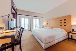 Postel nebo postele na pokoji v ubytování Hotel Lux Fatima