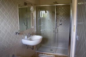 a bathroom with a sink and a shower at Agriturismo 'A Lanterna in Marina di Monasterace