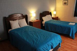 Postel nebo postele na pokoji v ubytování Hotel Náutico de Paita