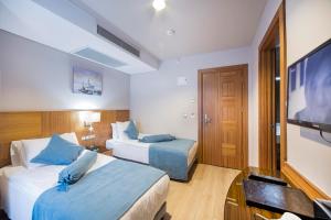 Кровать или кровати в номере The Meretto Hotel Istanbul Old City