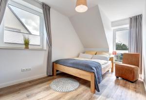 Säng eller sängar i ett rum på Haus Wellenreiter