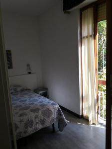 a bedroom with a bed and a window at Albergo Al Carugio in Monterosso al Mare